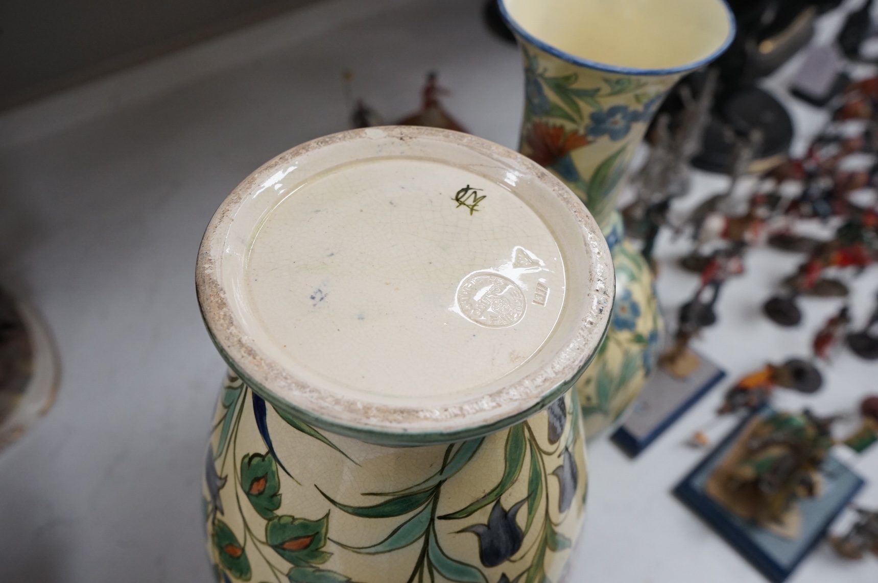 A pair of Doulton Lambeth Persian inspired faience vases, dated 1877, restored, 37cm high